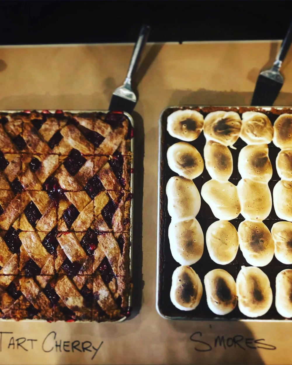 Trays of tart cherry and s'mores hand pies fresh from the oven